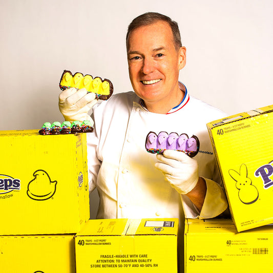 Chef Jacques Torres holding chick Peeps covered in milk and dark chocolate for Easter