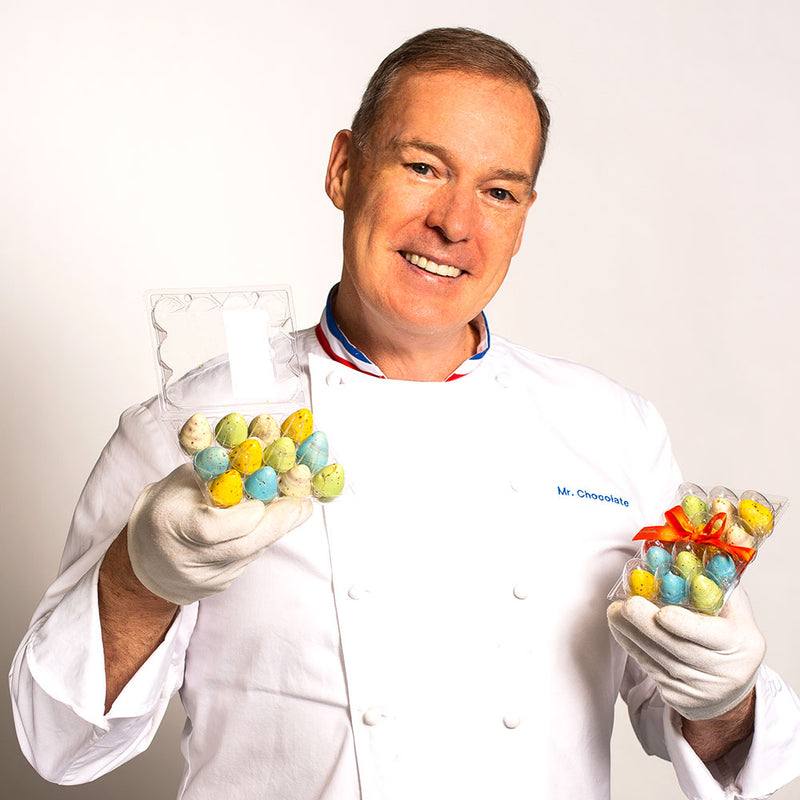 Chef Jacques Torres  holding Easter Egg Caramel Bonbons