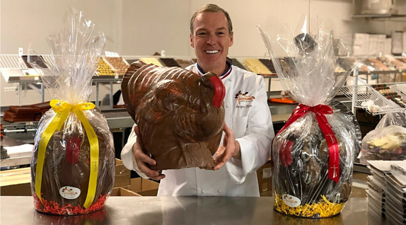 Jacques Torres holding his large chocolate turkey