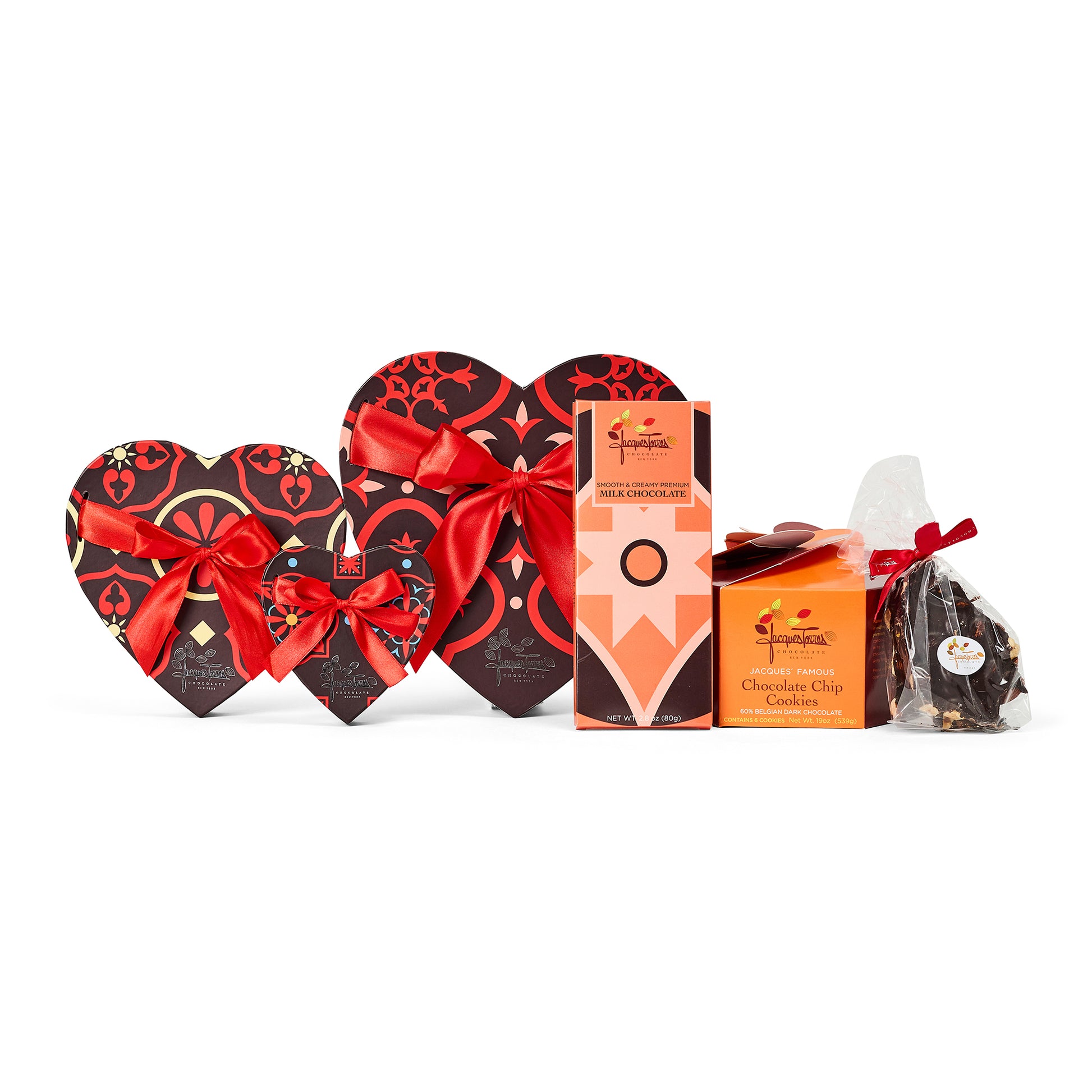 Heart-shaped chocolate boxes with red ribbons and a box of cookies on a white background