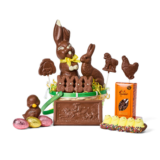 Assorted Jacques' dark chocolate Easter treats in a gift basket on a white background.