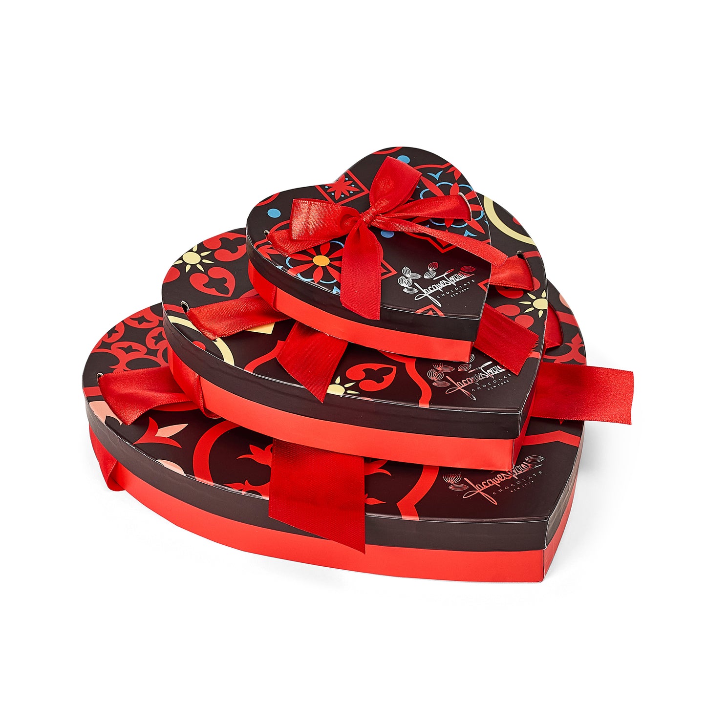 Stack of heart-shaped chocolate boxes with red ribbons on a white background