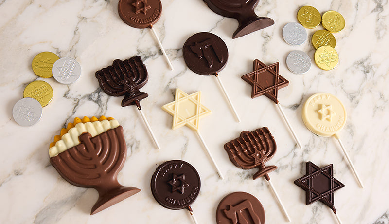 Hanukkah chocolate menorahs, gelt and lollipops