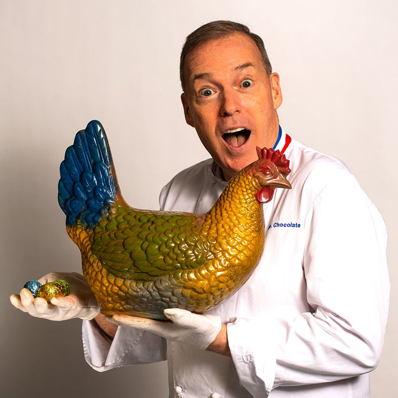 Chef Jacques Torres holding giant chocolate chicken for Easter