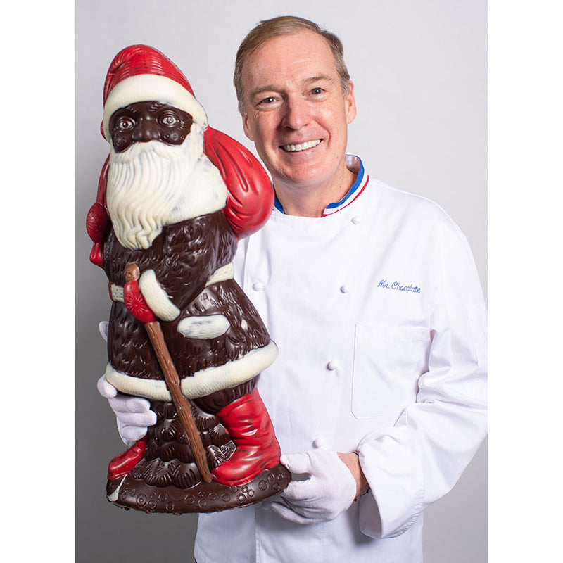 Chef Jacques Torres holding Dark Chocolate Giant Santa