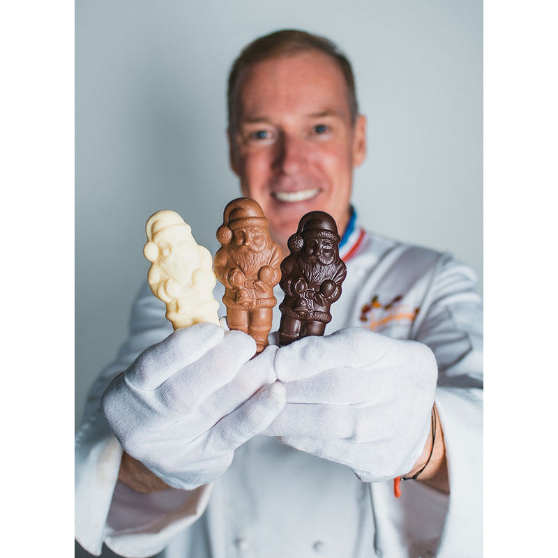 Chef Jacques Torres holding Tiny Santas